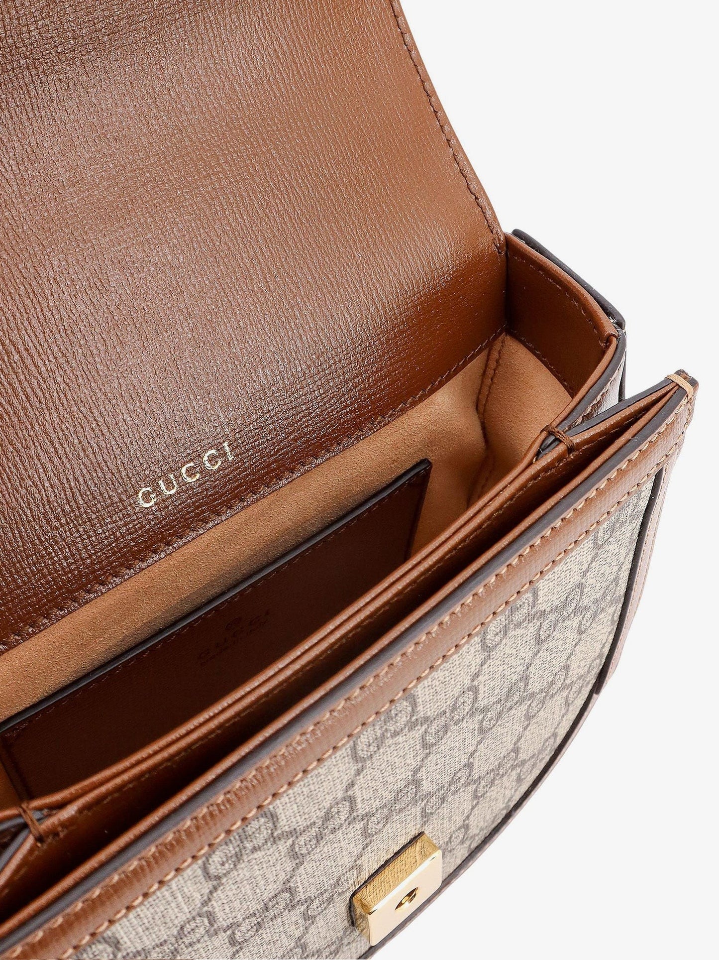 Gucci Gg supreme fabric and leather handbag with iconic horsebit
