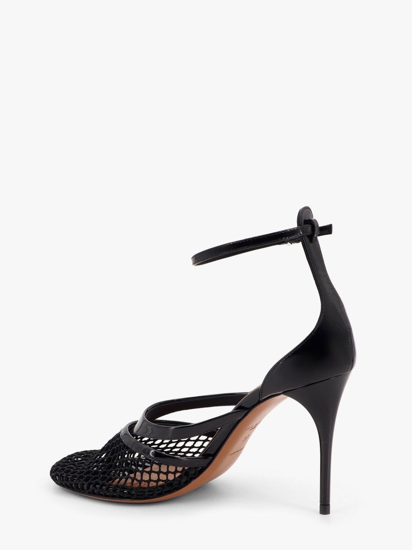 ALAIA Thong sandals in fishnet and patent leather