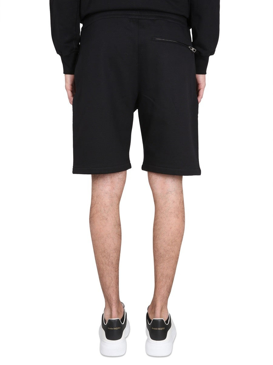 Alexander Mcqueen BERMUDA SHORTS WITH GRAFFITI LOGO PRINT