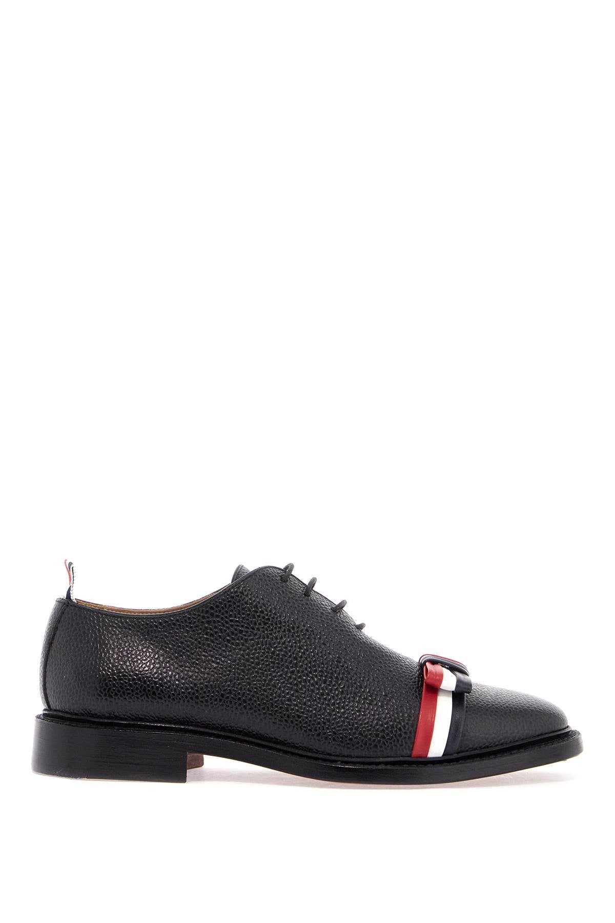 THOM BROWNE elegant wholecut shoes in black calfskin with rwb bow