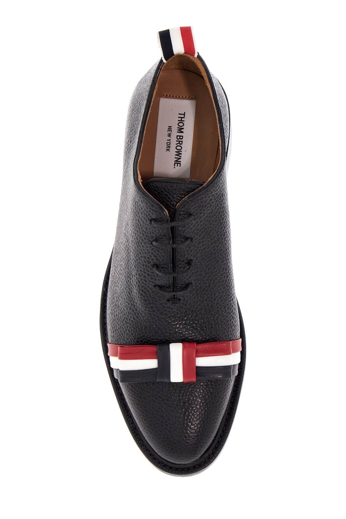 THOM BROWNE elegant wholecut shoes in black calfskin with rwb bow