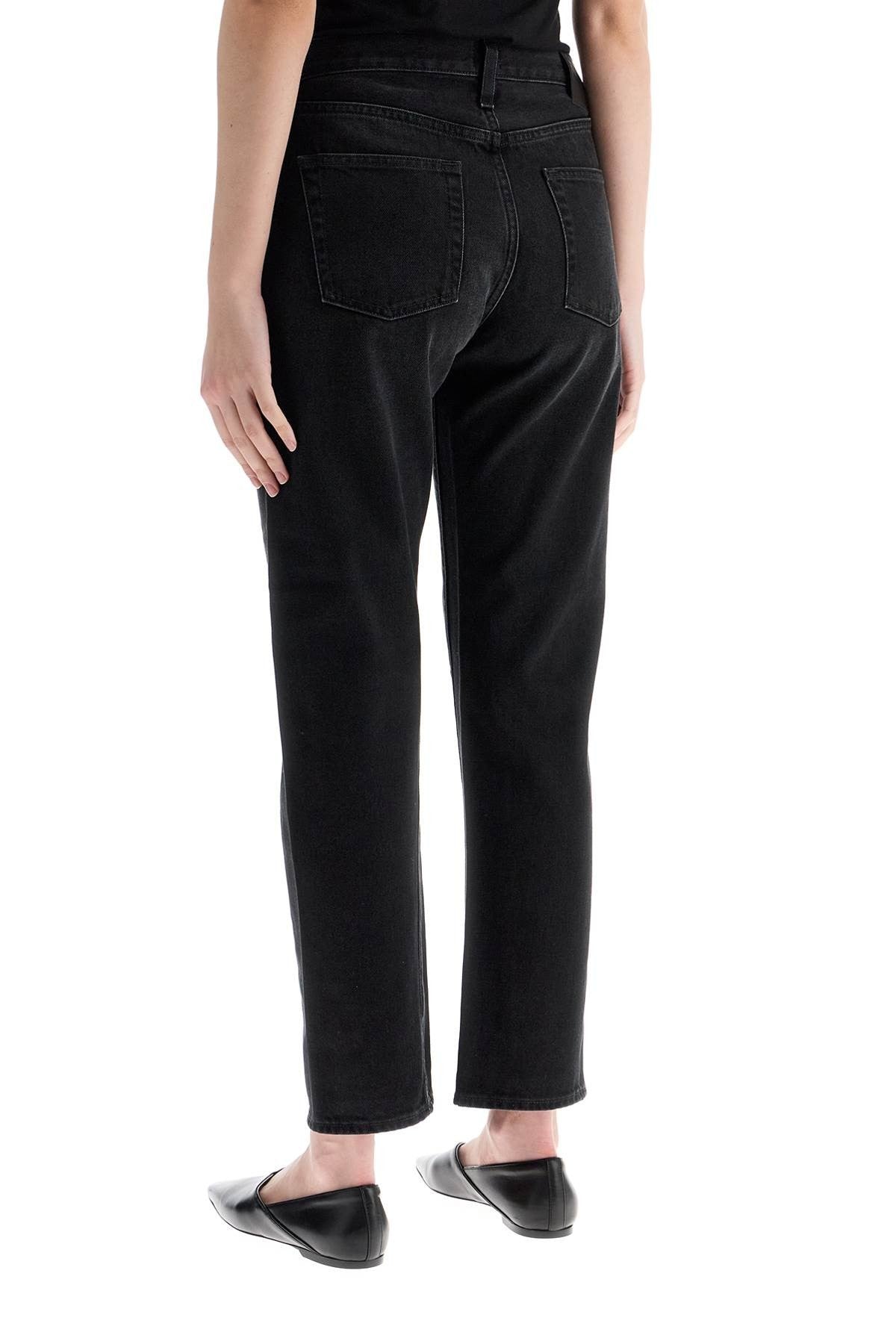 TOTEME faded black organic cotton jeans with twisted seams