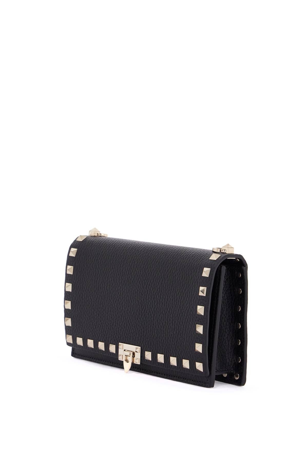 Valentino Garavani mini black leather bag with golden metal studs