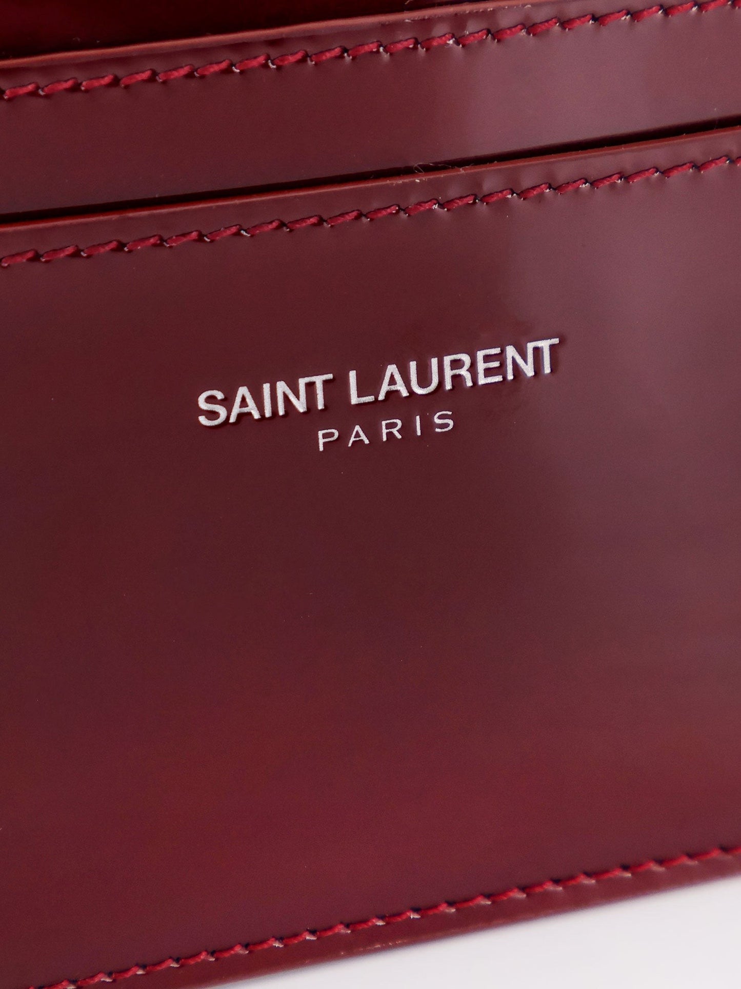 Saint Laurent Patent leather card holder with engraved ogo on the front