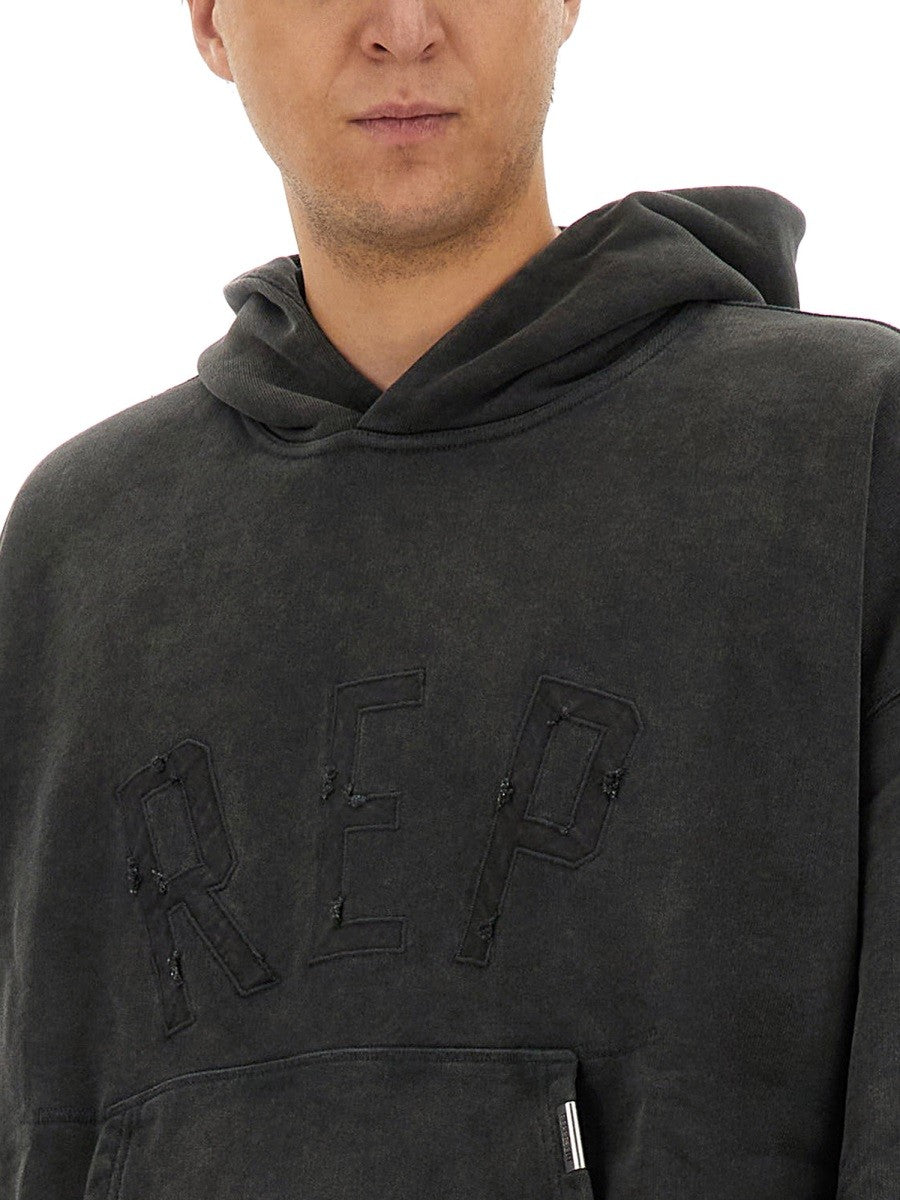 Represent "REP APPLIQUE" SWEATSHIRT