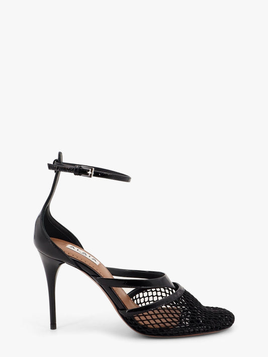 ALAIA Thong sandals in fishnet and patent leather