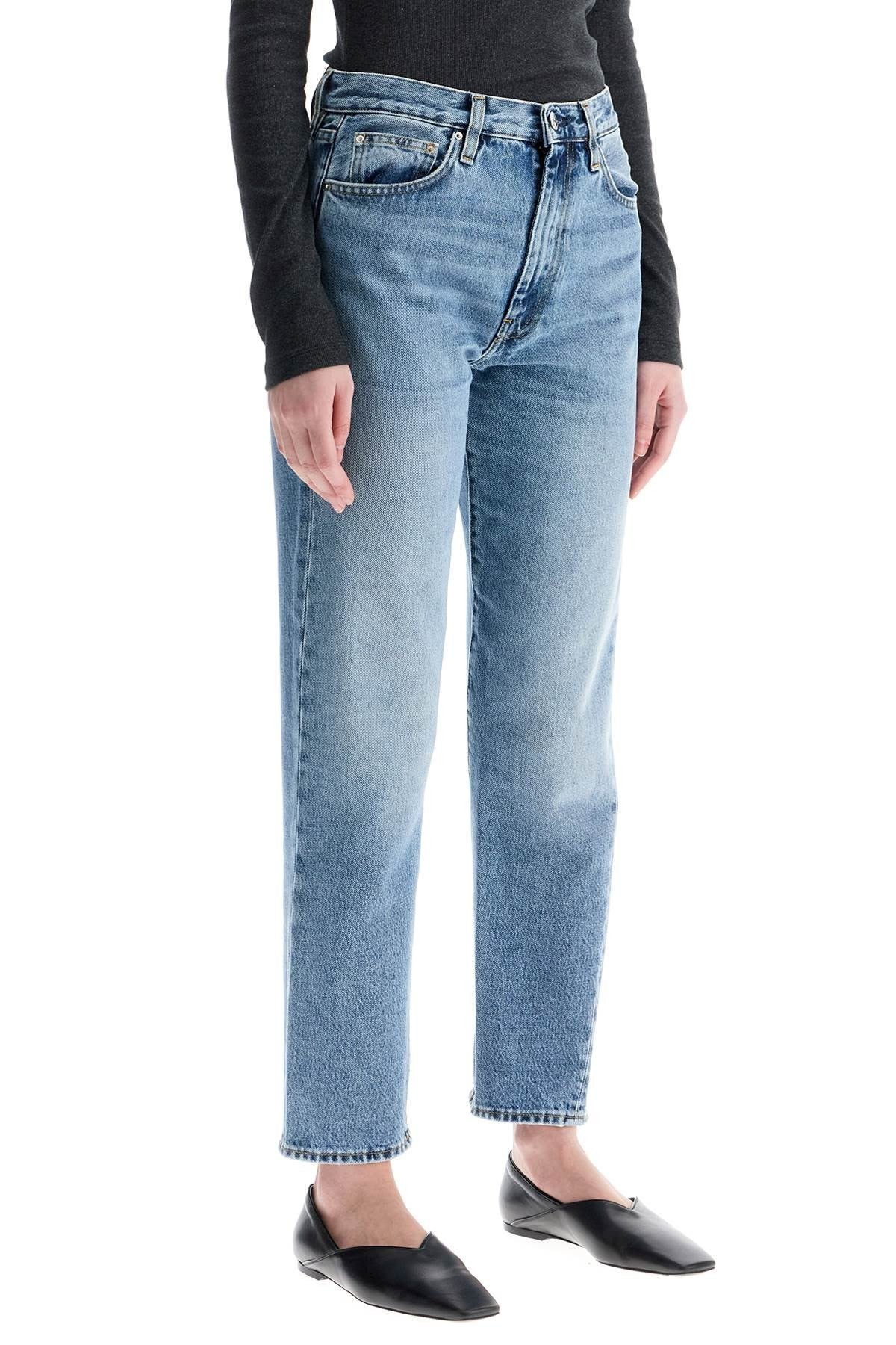 TOTEME worn blue organic cotton jeans with twisted seams